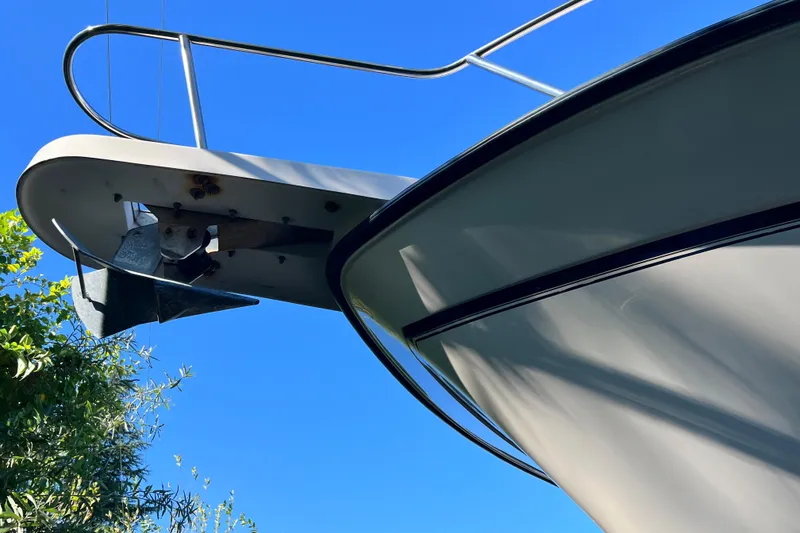 Slide: The Image of 2004 Grady-White Express 330 boat bow with anchor against clear blue sky. - 37