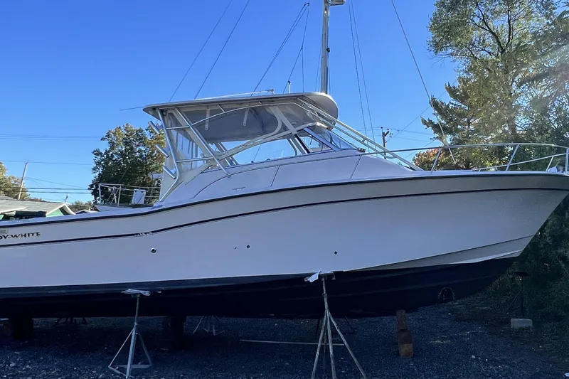Slide: The Image of 2004 Grady-White Express 330 boat on stands, clear sky background. - 38