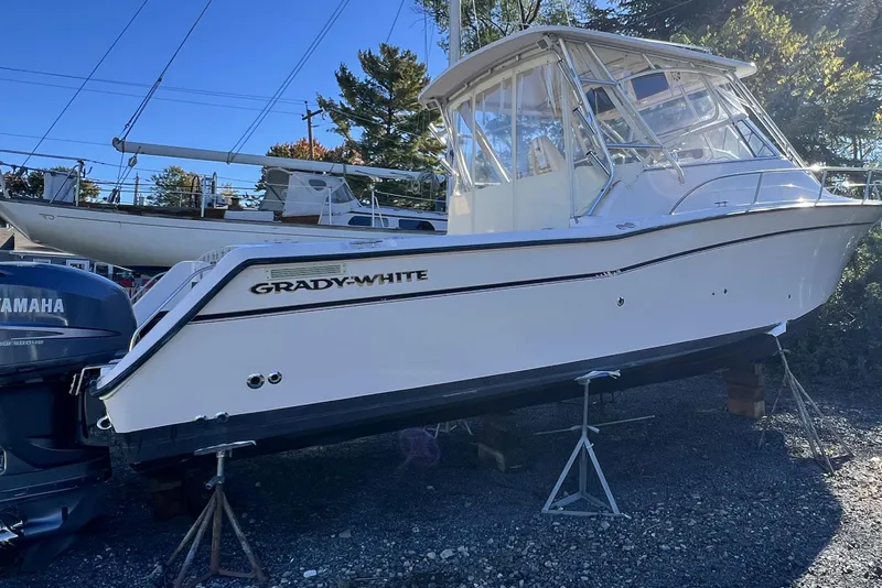 Slide: The Image of 2004 Grady-White Express 330 boat on stands, with Yamaha outboard motor. - 40