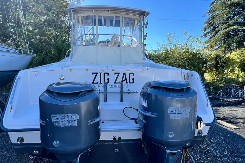 Slide: The Image of 2004 Grady-White Express 330 boat with twin Yamaha 250 engines, named "Zig Zag." - 6