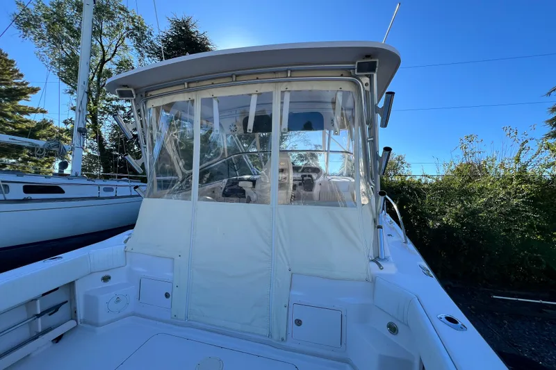 Slide: The Image of 2004 Grady-White Express 330 boat with enclosed cockpit, docked outdoors. - 8
