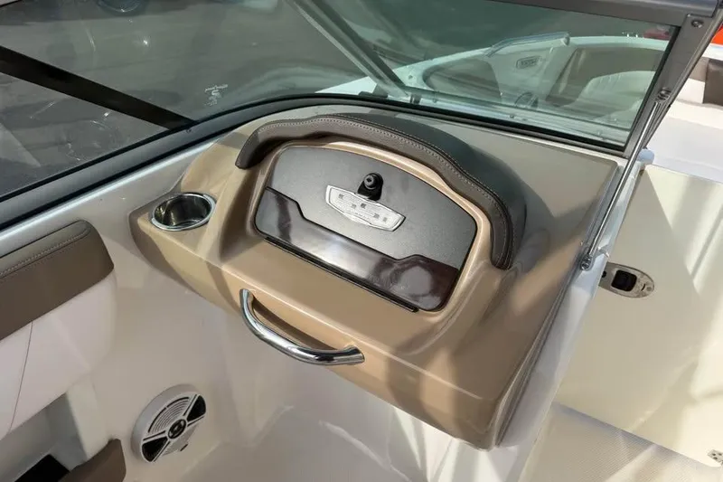 Slide: The Image of 2020 Chaparral 21 SSi OB boat dashboard with cup holder and speaker. - 10