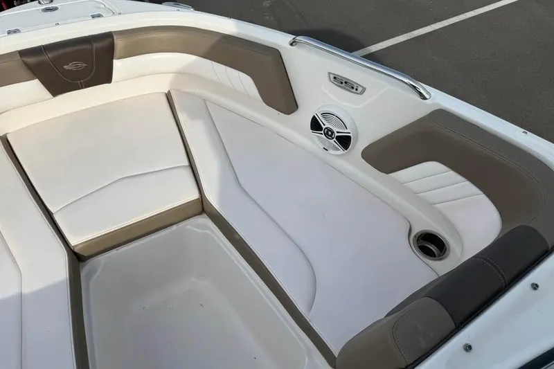 Slide: The Image of 2020 Chaparral 21 SSi OB boat interior with cushioned seating and speaker. - 14