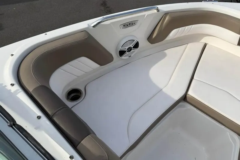 Slide: The Image of 2020 Chaparral 21 SSi OB boat interior with cushioned seating and speaker. - 15