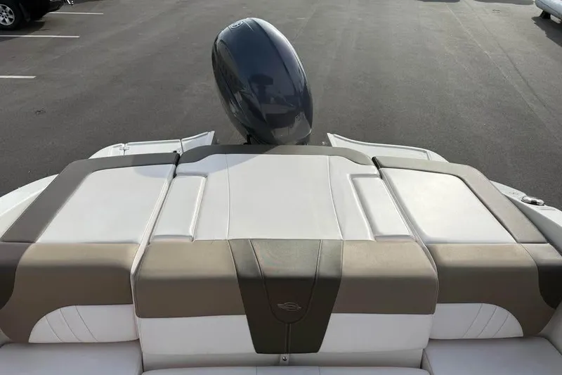 Slide: The Image of 2020 Chaparral 21 SSi OB boat with sleek seating and outboard motor. - 8