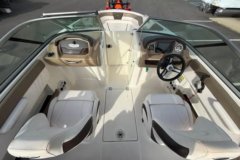 Slide: The Image of 2020 Chaparral 21 SSi OB boat interior with dual seats and steering console. - 9