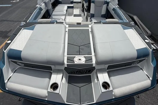 Slide: The Image of 2021 Malibu M240 boat interior with spacious seating and modern design. - 15