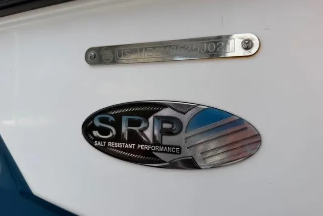 Slide: The Image of 2021 Malibu M240 boat with SRP (Salt Resistant Performance) badge and identification plate. - 18