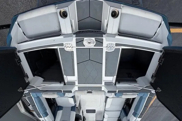 Slide: The Image of 2021 Malibu M240 boat interior with spacious seating and modern design. - 19