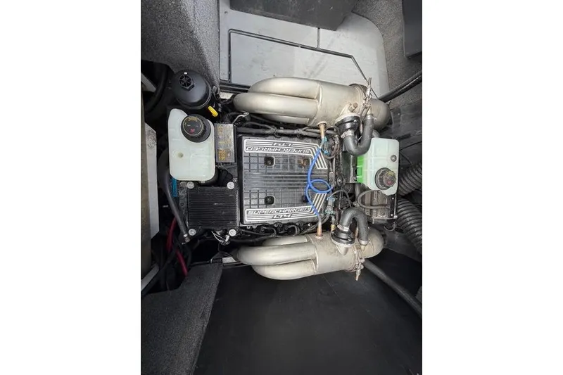 Slide: The Image of 2021 Malibu M240 engine compartment showcasing a supercharged engine with detailed components. - 20
