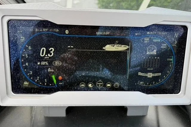 Slide: The Image of Dashboard display of a 2021 Malibu M240 boat showing speed and system indicators. - 21
