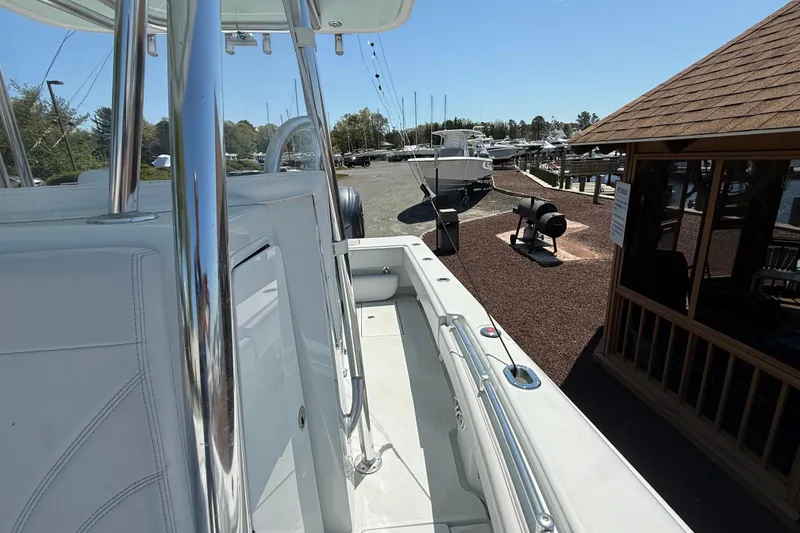 Slide: The Image of 2024 Contender 25 Tournament boat docked at a marina under clear blue skies. - 14
