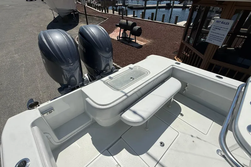 Slide: The Image of 2024 Contender 25 Tournament boat with dual engines and seating area. - 17
