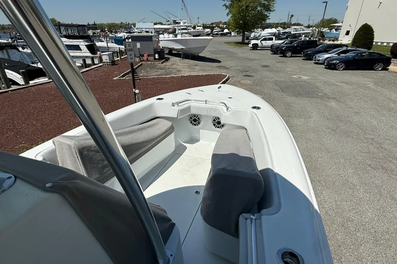 Slide: The Image of 2024 Contender 25 Tournament boat with spacious seating, docked at a marina. - 21