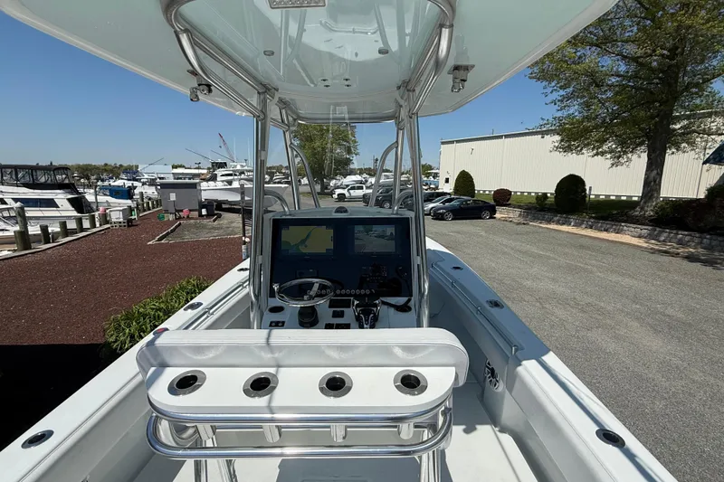 Slide: The Image of 2024 Contender 25 Tournament boat with advanced navigation system at marina. - 8
