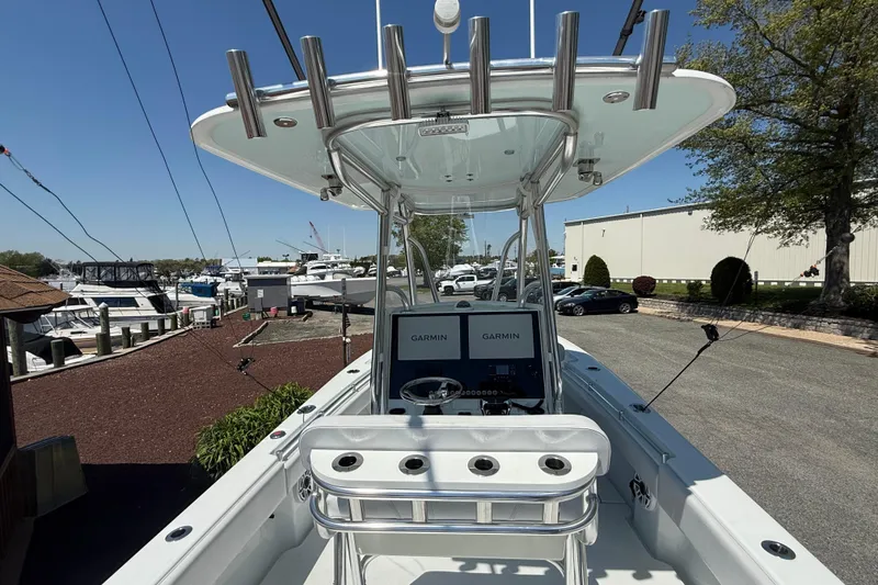 Slide: The Image of 2024 Contender 25 Tournament boat with Garmin navigation, docked at a marina. - 9