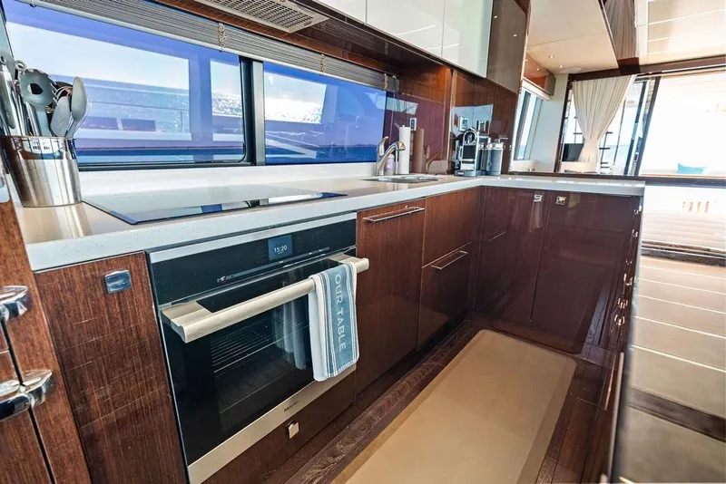 Slide: The Image of Luxurious kitchen interior of 2019 Sunseeker 76 Yacht with modern appliances and sleek design. - 16