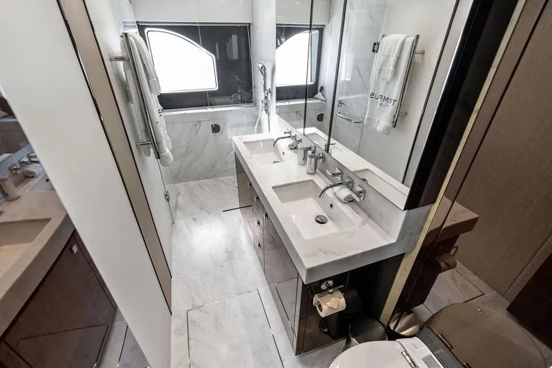 Slide: The Image of Luxurious bathroom in a 2019 Sunseeker 76 Yacht, featuring dual sinks and elegant marble finishes. - 37