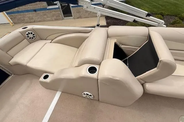Slide: The Image of Luxurious seating on a 2012 Bennington 2574 GCW pontoon boat with cup holders and speakers. - 15