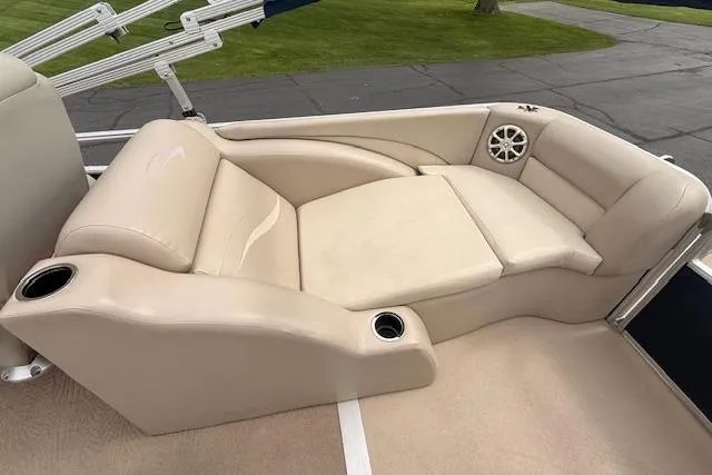 Slide: The Image of Luxurious seating on 2012 Bennington 2574 GCW pontoon boat with beige upholstery. - 16