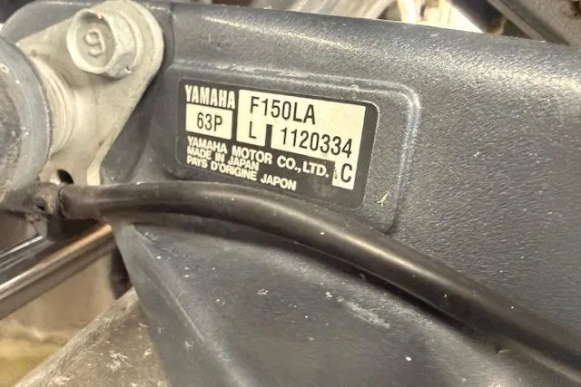 Slide: The Image of Yamaha F150LA engine label on a 2012 Bennington 2574 GCW boat. - 26