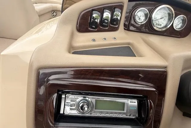 Slide: The Image of Dashboard of a 2012 Bennington 2574 GCW boat with stereo and gauges. - 8