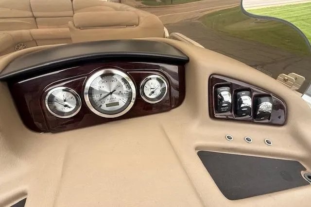 Slide: The Image of Dashboard of a 2012 Bennington 2574 GCW boat with gauges and controls. - 9