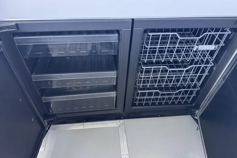 Slide: The Image of Interior storage compartments on a 2015 Armstrong Marine Power Cat. - 10