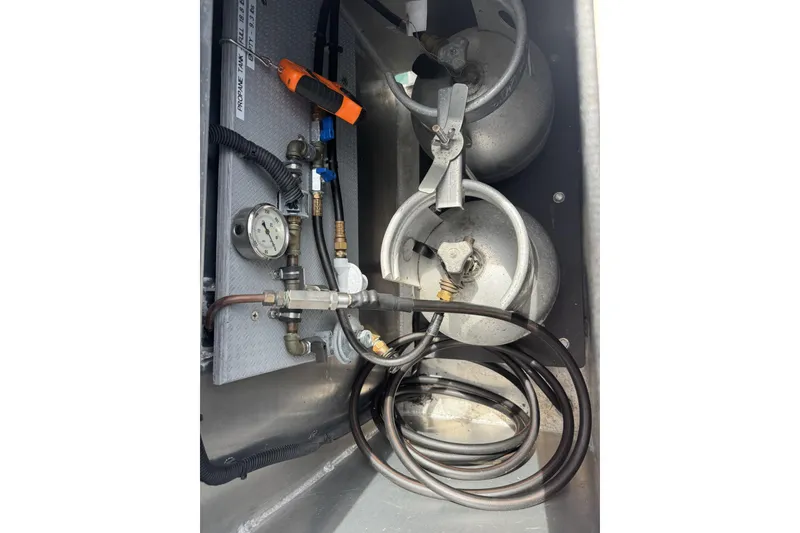 Slide: The Image of Propane tank setup in 2015 Armstrong Marine Power Cat boat. - 14