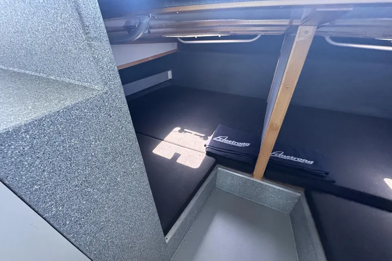 Slide: The Image of 2015 Armstrong Marine Power Cat interior cabin with cushioned seating. - 4