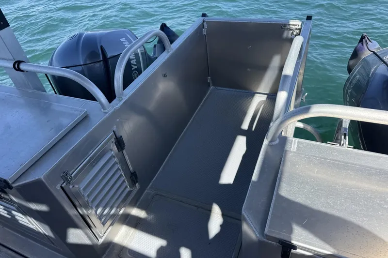 Slide: The Image of 2015 Armstrong Marine Power Cat deck with Yamaha engines on water. - 6