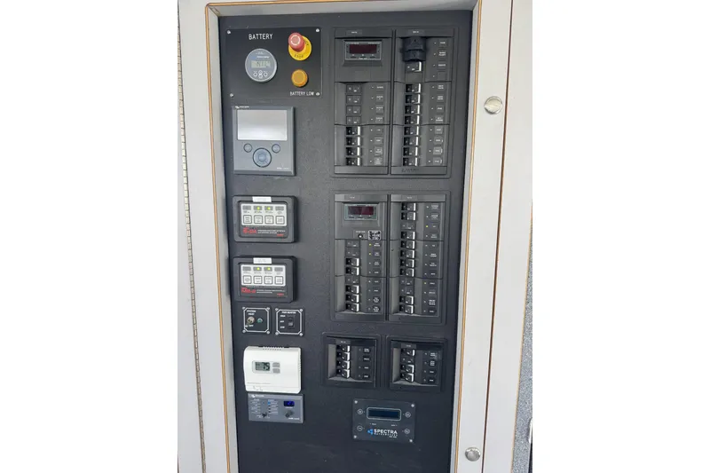 Slide: The Image of Electrical control panel on a 2015 Armstrong Marine Power Cat boat. - 8