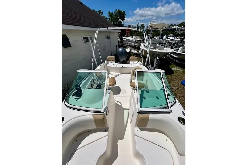 Slide: The Image of 2015 Pioneer 175 Venture boat with open deck and windshield, parked outdoors. - 3