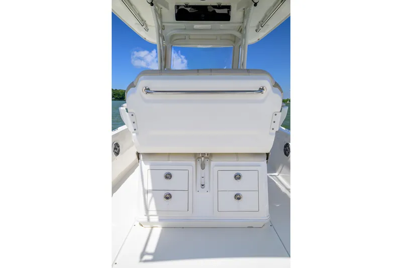 Slide: The Image of 2023 Boston Whaler 280 Dauntless boat interior with storage compartments and seating. - 16