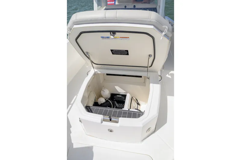 Slide: The Image of Open storage compartment on 2023 Boston Whaler 280 Dauntless boat, showcasing interior space. - 23