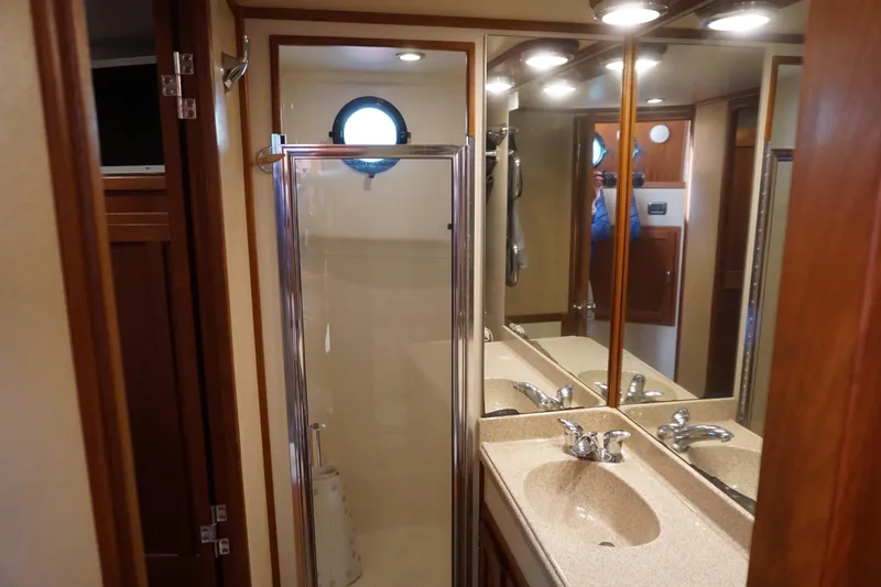 Slide: The Image of Bathroom interior of 2004 American Tug 34 with shower and vanity. - 35