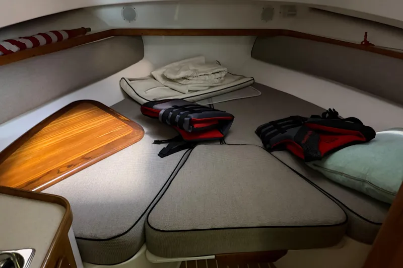 Slide: The Image of Cozy cabin interior of 2007 Hunt Yachts Surfhunter 29 with cushions and life vests. - 10