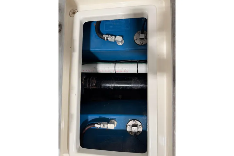 Slide: The Image of 2007 Hunt Yachts Surfhunter 29 engine compartment with visible components and wiring. - 15