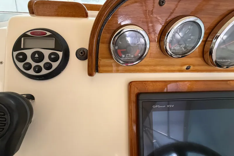 Slide: The Image of 2007 Hunt Yachts Surfhunter 29 dashboard with gauges and GPSMAP XSV display. - 6