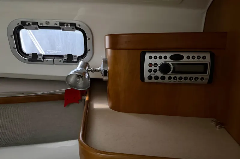 Slide: The Image of 2007 Hunt Yachts Surfhunter 29 cabin interior with radio and porthole. - 9