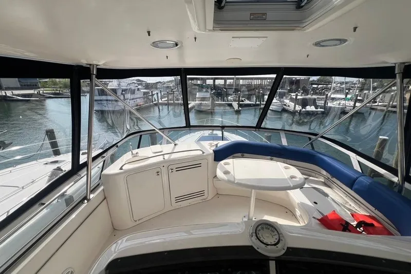 Slide: The Image of Interior view of 2001 Sea Ray 480 Sedan Bridge yacht at marina dock. - 17