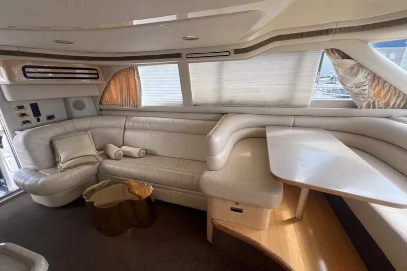 Slide: The Image of Luxurious interior of a 2001 Sea Ray 480 Sedan Bridge yacht with plush seating and elegant decor. - 25
