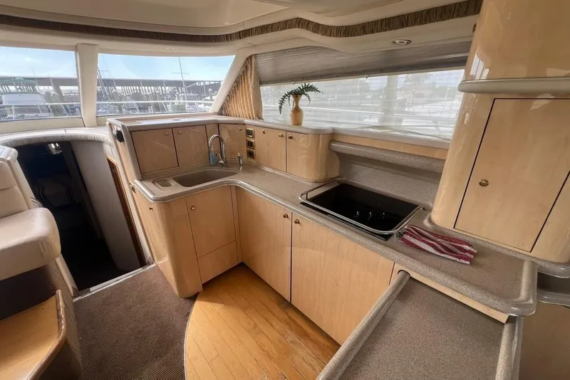 Slide: The Image of Luxurious kitchen interior of 2001 Sea Ray 480 Sedan Bridge yacht. - 26