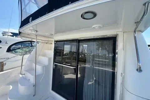 Slide: The Image of 2001 Sea Ray 480 Sedan Bridge yacht with sliding glass doors and exterior stairs. - 39