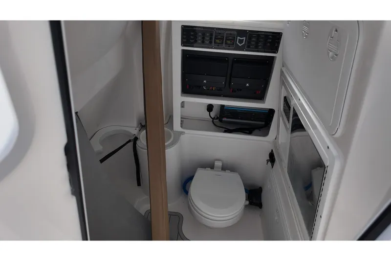 Slide: The Image of Interior of 2026 Sea Fox 288 Commander boat featuring a compact marine toilet. - 11