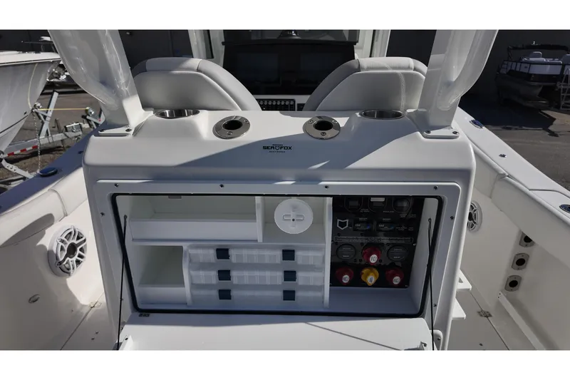 Slide: The Image of 2026 Sea Fox 288 Commander boat console with storage compartments and control panel. - 16