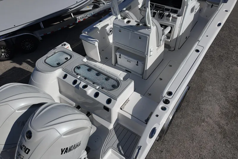 Slide: The Image of 2026 Sea Fox 288 Commander boat interior with Yamaha engines, showcasing seating and control panel. - 4