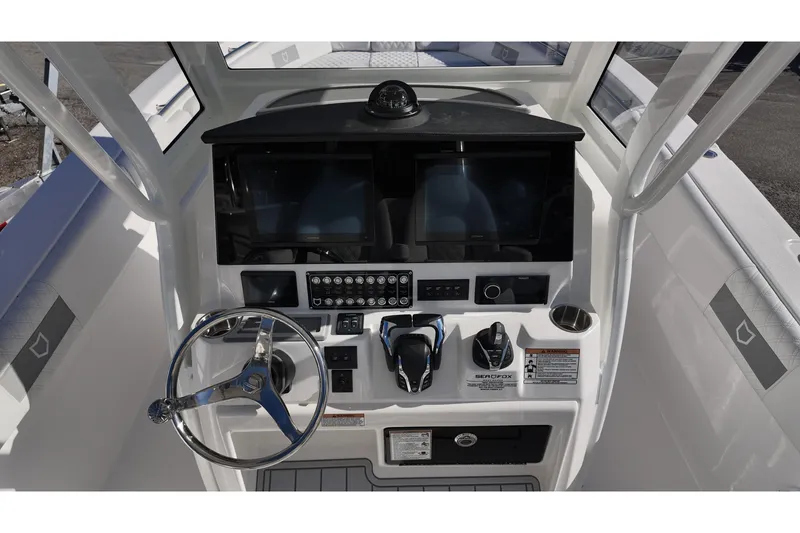 Slide: The Image of 2026 Sea Fox 288 Commander helm with dual screens and modern controls. - 6