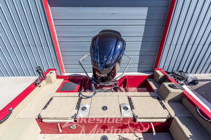 Slide: The Image of 2020 G3 Angler V19 FS boat with outboard motor in a storage area. - 12