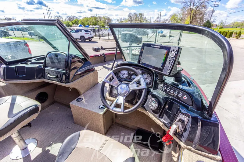 Slide: The Image of 2020 G3 Angler V19 FS boat interior with steering wheel and navigation system. - 16